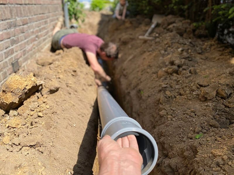 Experienced plumbers repairing water pipes for a home in Pasadena, MD