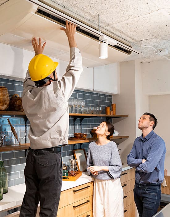 An experienced technician repairing an air conditioner for a residential home in Pasadena, MD